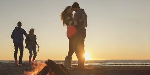 Image showing Friends having fun at beach on autumn day