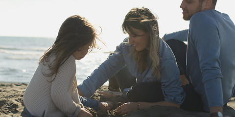 Image showing Young family enjoying vecation during autumn