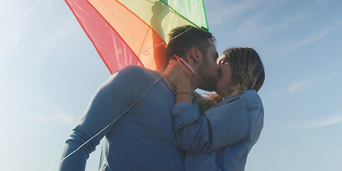 Image showing Happy couple having fun with kite on beach