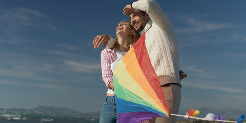 Image showing Happy couple having fun with kite on beach