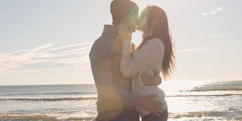 Image showing Couple having fun on beautiful autumn day at beach