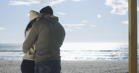 Image showing Couple having fun on beautiful autumn day at beach