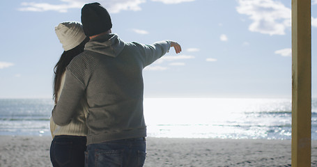 Image showing Couple having fun on beautiful autumn day at beach