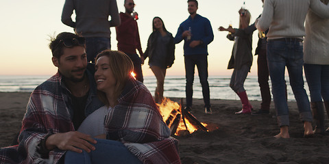 Image showing Friends having fun at beach on autumn day