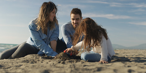 Image showing Young family enjoying vecation during autumn