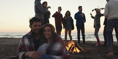 Image showing Friends having fun at beach on autumn day