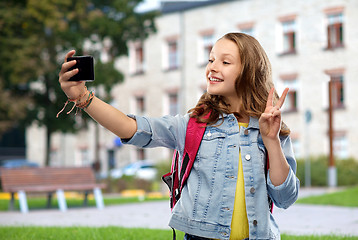 Image showing teenage student girl taking selfie by smartphone