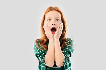 Image showing shocked red haired girl in with open mouth