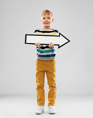 Image showing boy holding big white rightwards thick arrow