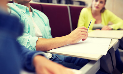 Image showing group of students with notebooks at lecture hall