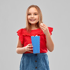 Image showing beautiful smiling girl in red shirt and skirt