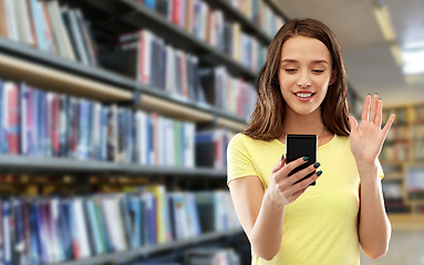 Image showing smiling teenage girl having video call smartphone