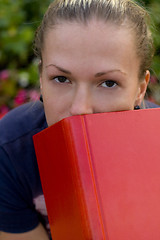 Image showing woman with red book