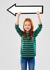 Image showing smiling red haired girl with arrow showing to left