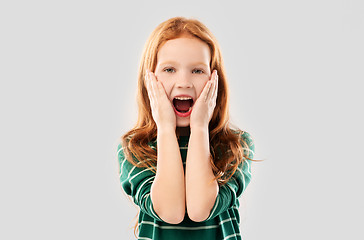 Image showing shocked or surprised red haired girl screaming