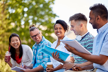 Image showing group of happy students with notebooks and drinks