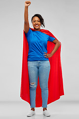 Image showing happy african american woman in superhero red cape