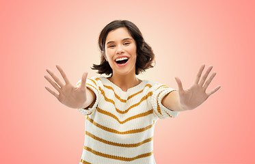 Image showing happy woman showing ten fingers of two hands