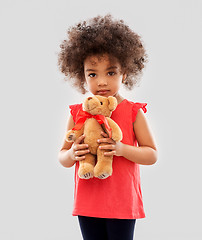 Image showing sad little african american girl with teddy bear