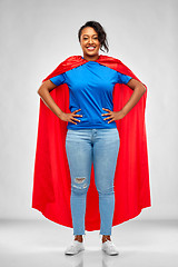 Image showing happy african american woman in superhero red cape