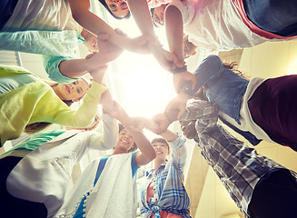 Image showing group of international students holding hands