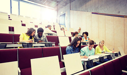 Image showing group of students with notebooks at lecture hall