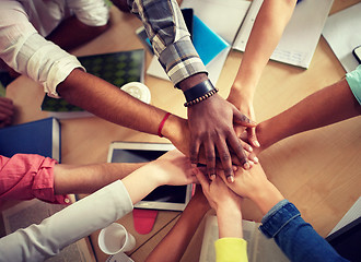 Image showing close up of international students hands on top