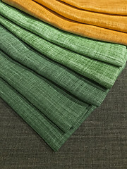 Image showing Choice of green and yellow textiles