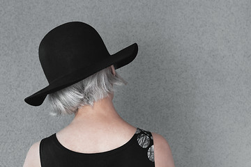 Image showing Lady with gray hair in black hat
