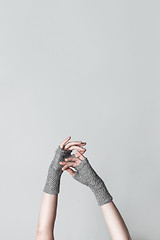 Image showing Elegant hands in knitted gloves