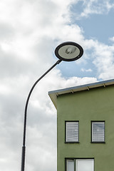 Image showing Streetlamp and facade of a green house