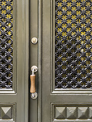 Image showing Green door with ornamental windows