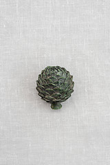 Image showing Metal artichoke on canvas background