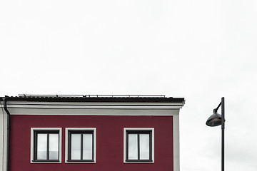 Image showing Streetlamp near a modern red building