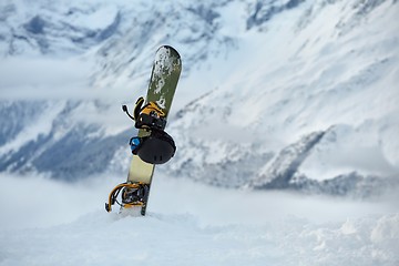 Image showing Snowboard high up in the snowy Alps