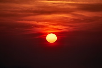 Image showing Sunset through cloudy red sky