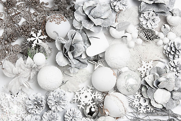 Image showing Christmas decorative composition of toys on a white background surrealism. Top view