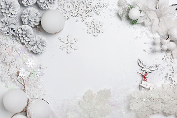 Image showing Christmas decorative composition of toys on a white background surrealism. Top view