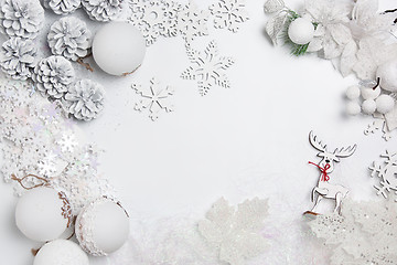 Image showing Christmas decorative composition of toys on a white background surrealism. Top view