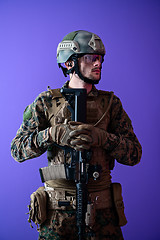 Image showing modern warfare soldier purple backgorund