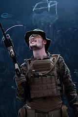 Image showing soldier potrait closeup in front of black chalkboard