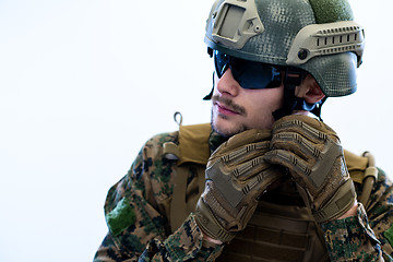 Image showing soldier preparing gear for action