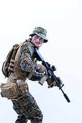 Image showing soldier in action aiming laseer sight optics