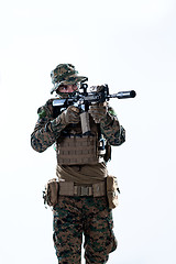 Image showing soldier in action aiming laseer sight optics