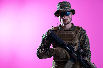 Image showing modern warfare soldier pink backgorund