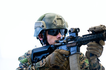 Image showing soldier in action aiming laseer sight optics