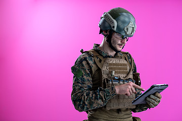 Image showing soldier using tablet computer closeup