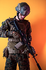 Image showing modern soldier against yellow background