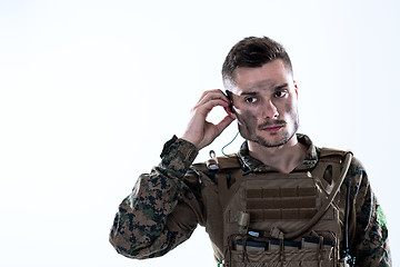 Image showing soldier preparing gear for action