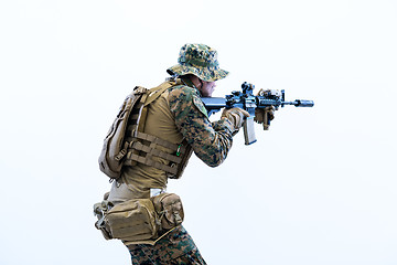 Image showing soldier in action aiming laseer sight optics